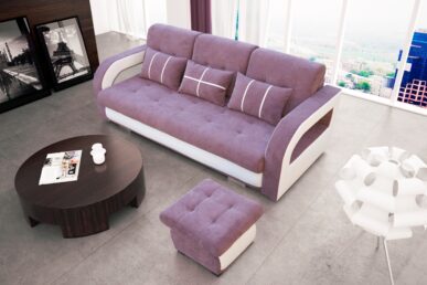NADINE fioletowa to elegancka kanapa z oryginalnymi bokami w komplecie z pufą. Rozkładana